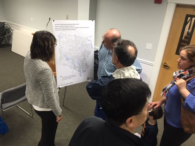 Residents viewing a map of Framingham. 