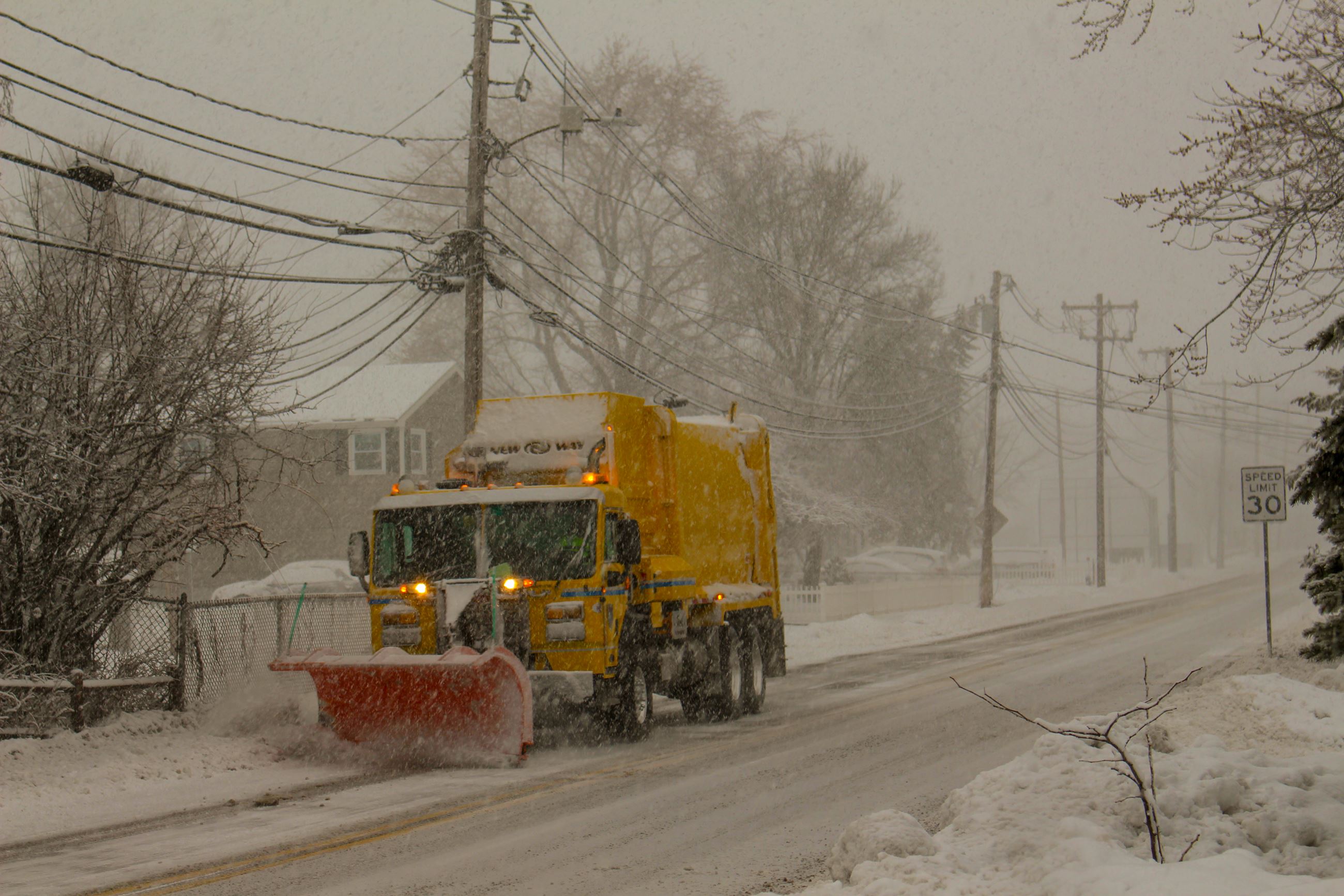 Photo of a sanitation truck plowing snow (JPEG)
